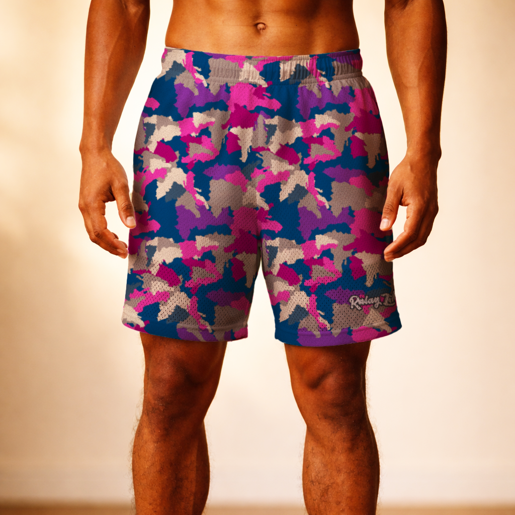 Person wearing colorful camouflage shorts on a wooden floor. Dominican shorts