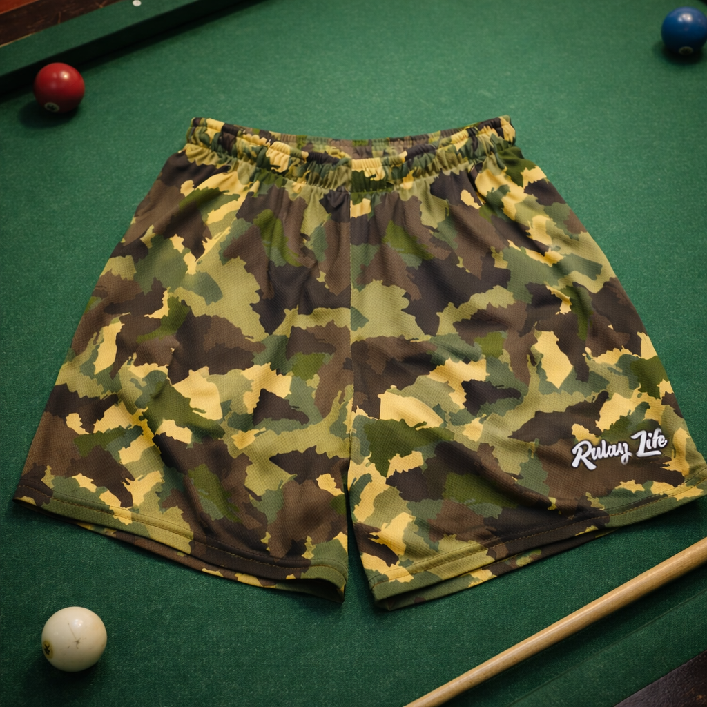 Camouflage shorts with a brand logo on a pool table. Dominican shorts