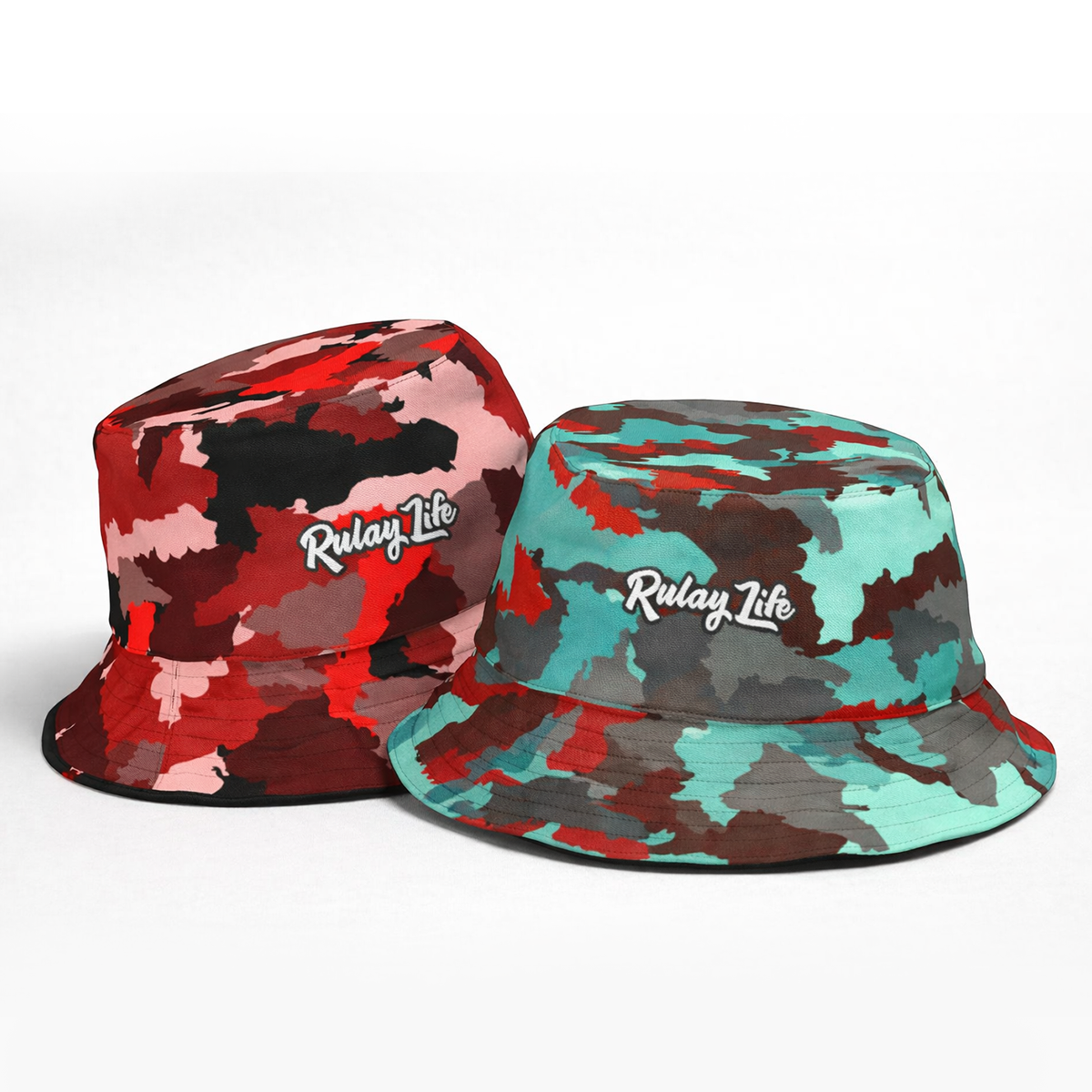 Two camouflage bucket hats with 'Rulay Life' logo on a white background. Dominican Camo Reversible bucket hat (Ruby+Bloodstone)